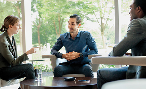 Man attentively listening during a business meeting in a bright office.